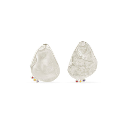 Asymmetrical shell earrings with stones.