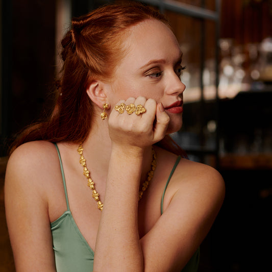 Brincos mini articulados com pedra, Flora