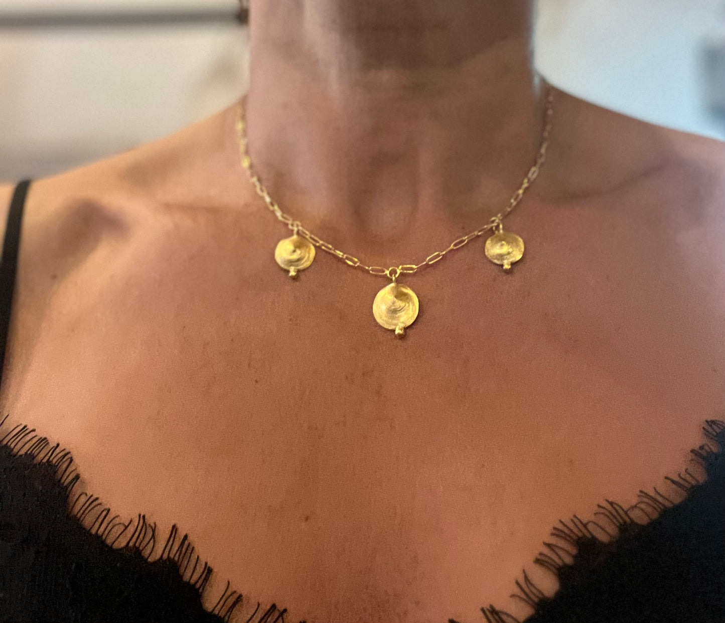 Pendant with 3 shells and nuggets.