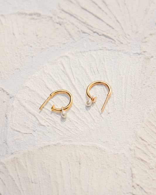 Mini hoop earrings with a gemstone.