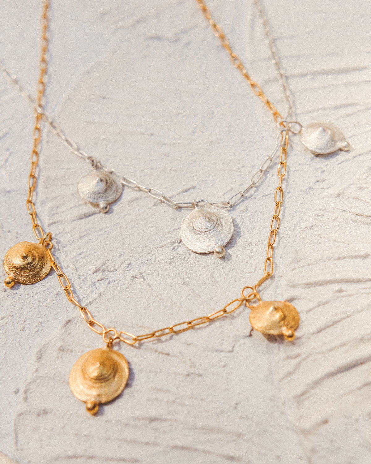 Pendant with 3 shells and nuggets.