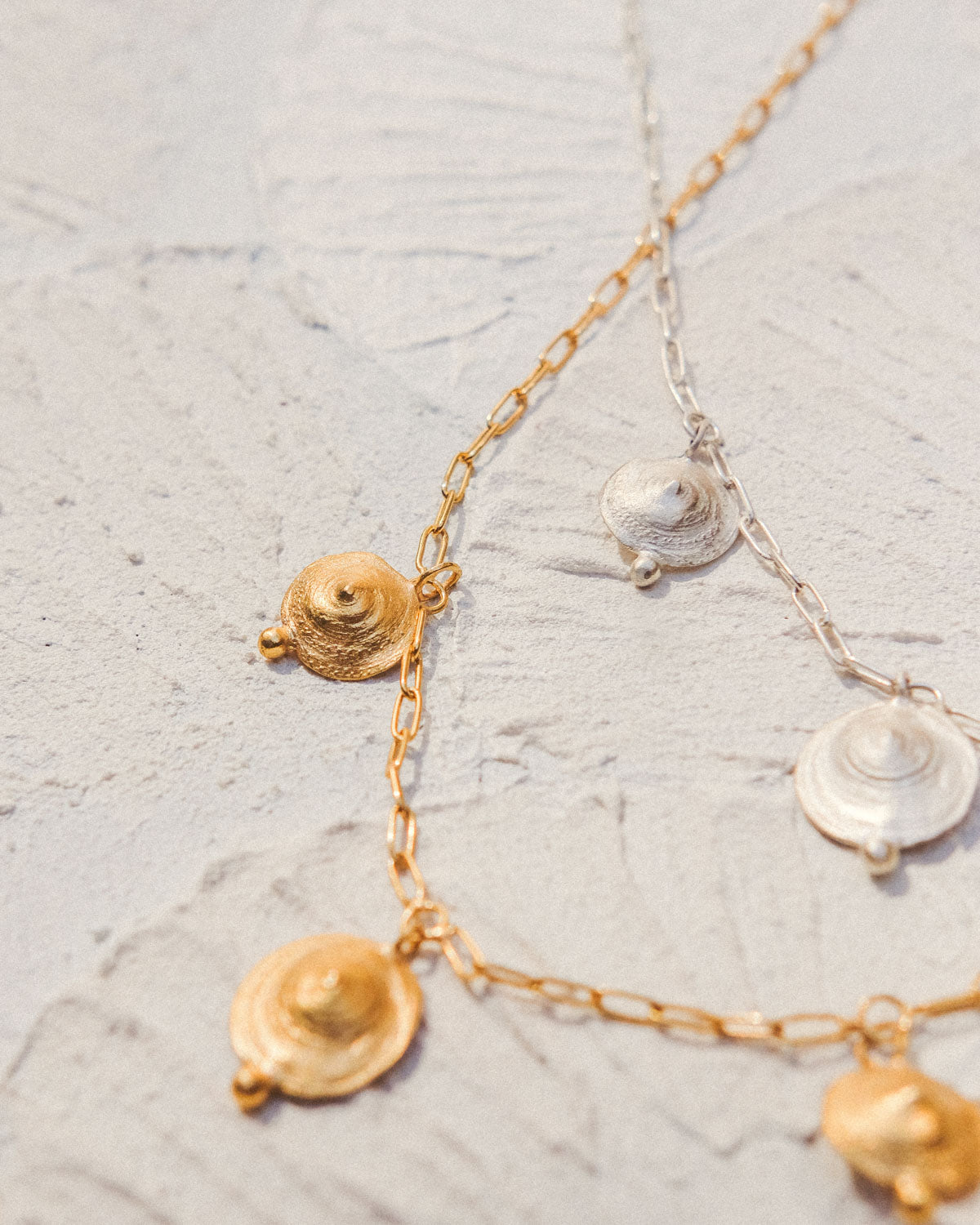 Pendant with 3 shells and nuggets.